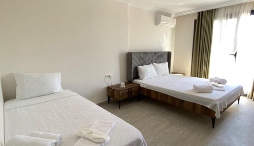 Family Triple Room, Balcony, Garden View