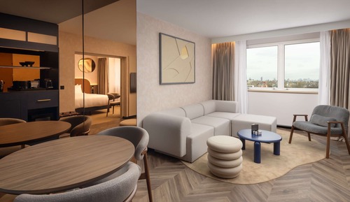 Jr Suite King Bed, Bath and Rainfall Shower. Living area with Sofa, High Floor with City View