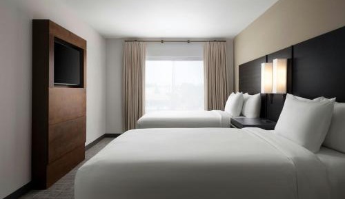 One-Bedroom Suite with Two Queen Beds, Sofa Bed, and Roll-in Shower - Mobility Accessible