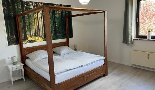 Holiday apartment with sauna, four-poster bed and whirlpool bath