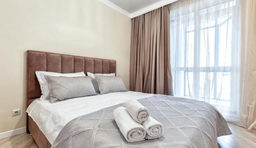 One-Bedroom Apartment with Balcony and City View