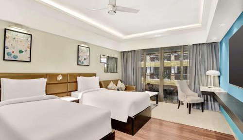 Premium Room Pool View and Balcony - Welcome pint of beer on arrival + Buy 1 Get 1 (IMFL) + Free Night Club Access (T&C*)