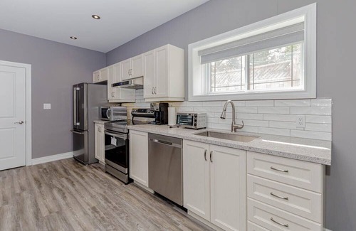 Pickering House | Lower flat with full access to lower patio and backyard , close to the beach .