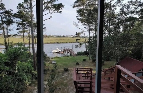 Long Beach Apartment | Scenic 3-bedroom apartment with WiFi, AC on Davis Canal in Oak Island.