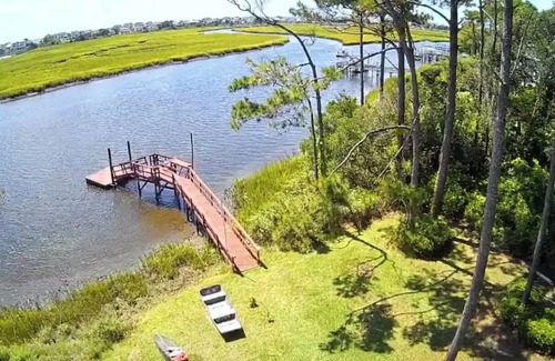 Long Beach Apartment | Scenic 3-bedroom apartment with WiFi, AC on Davis Canal in Oak Island.