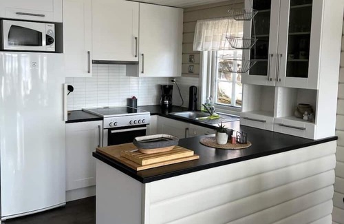 Lindesnes House | Holiday home Mona in Lussevika, new addition 2024, near Spangereid-Lindesnes, southern Norway, , max. 6 adults, own boat mooring, approx. 100 m² living space, 3 bedrooms, charming and tasteful furnishings, large veranda with fjord view, terrace f.