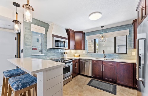 Bethune Beach Condo | Riverfront / Boat Dock / Pool / Walk to Beach / Cedar Island Club
