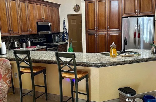 Miramar House | Beautiful lakefront retreat with outdoor kitchen, tiki hut and spa.