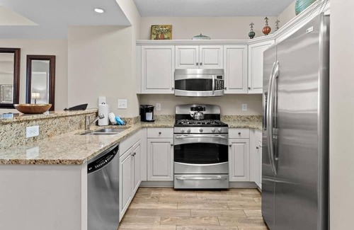 Windy Hill House | Aqua Escape: Oceanfront 2BR Condo with King & Queen Beds