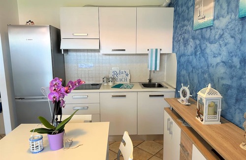 Aprilia Marittima Apartment | Flat in a colourful residence with pool