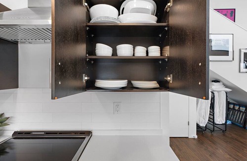 The Gulch Condo | Urban Condominium: Featuring a Pool and Balcony in a Contemporary Mid-Rise