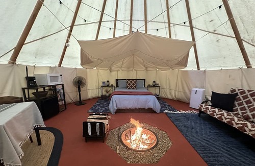 Steelville RV Rental | A teepee on 1200-acre ranch where secluded woods envelope the grounds.