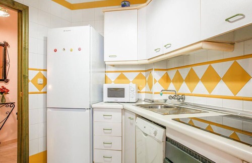 El Portil Apartment | Enjoy a relaxing vacation in this inviting vacation home with a community pool.