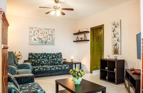 El Portil Apartment | Enjoy a relaxing vacation in this inviting vacation home with a community pool.