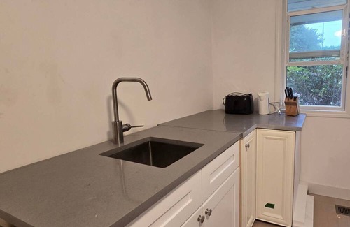 Steveston House | Guest Suite Studio One bedroom Large bathroom living room fenced yard Privacy