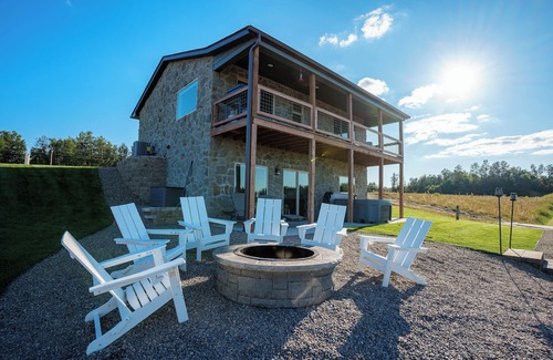 New Lisbon Cottage | Stone Cottage - Lakefront/Beach/Arcade/HotTub/MassageChair/2 Kings/Near WI Dells