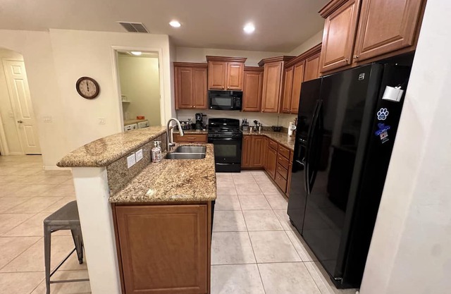 Peaceful, 4-bedroom oasis with fruit trees and sparkling pool.