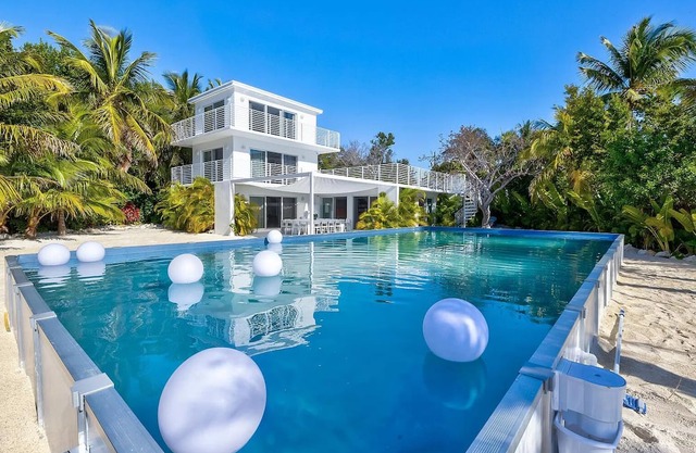Modern ocean side estate: 5 bed - 6 bath, big pool, 2 rooftops, small dock