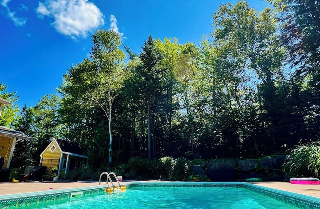 Charming family home with in-ground heated pool. Close to parks, lakes, & trail.