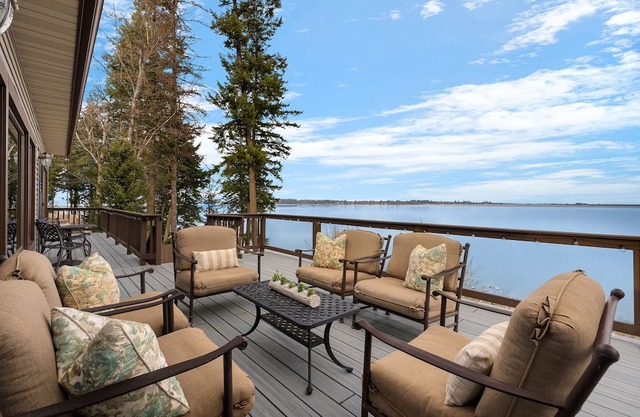 Waterfront home with private dock, beach, hot tub & wrap-around deck