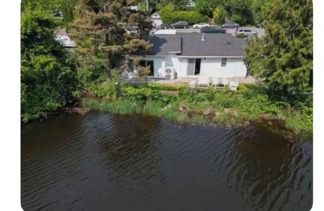 Cozy 3BR Riverside Retreat – Steps to Beach & Mineral Pool