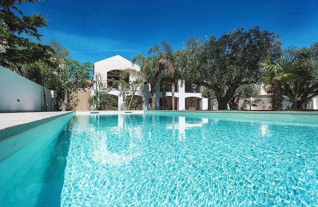 My Rental Homes - Casa Tika with shared pool surrounded by a wonderful garden
