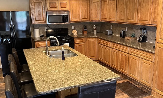 Board Camp House | Ride to the ATV trails from this Spacious 4-bedroom house with RV hookup!