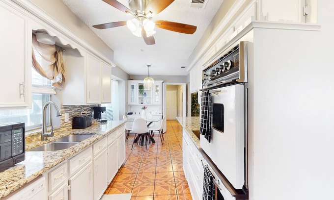 Richardson House | Private home with enclosed backyard, gas grill, sunny interior, & smart TVs