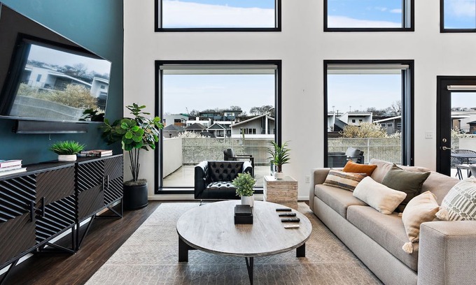The Gulch Condo | Urban Condominium: Featuring a Pool and Balcony in a Contemporary Mid-Rise