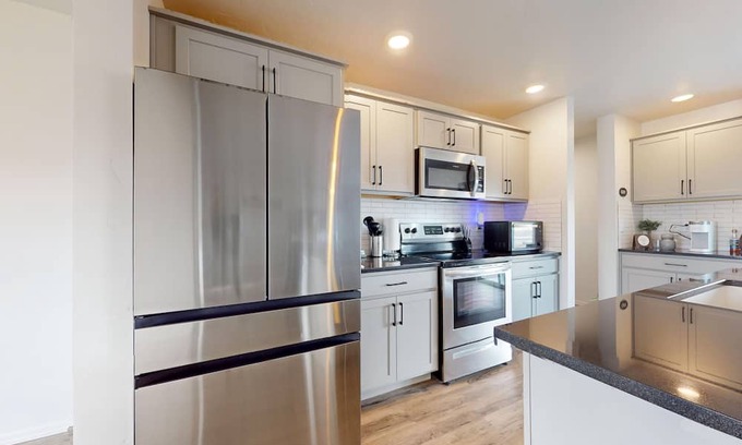 Meridian House | Newly built home with large fenced yard, 2 living rooms & great kitchen