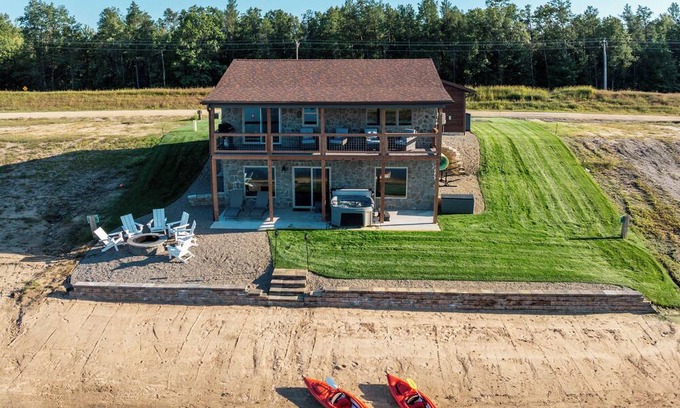 New Lisbon Cottage | Stone Cottage - Lakefront/Beach/Arcade/HotTub/MassageChair/2 Kings/Near WI Dells
